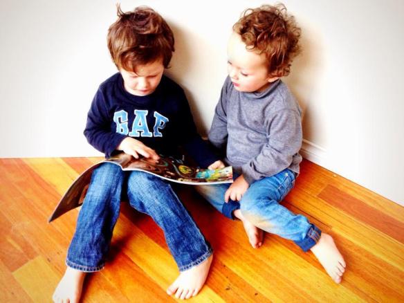 my eldest (then 4yo), reading to our youngest (then 2yo)